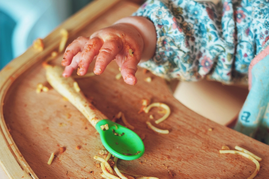Baby eating spaghetti